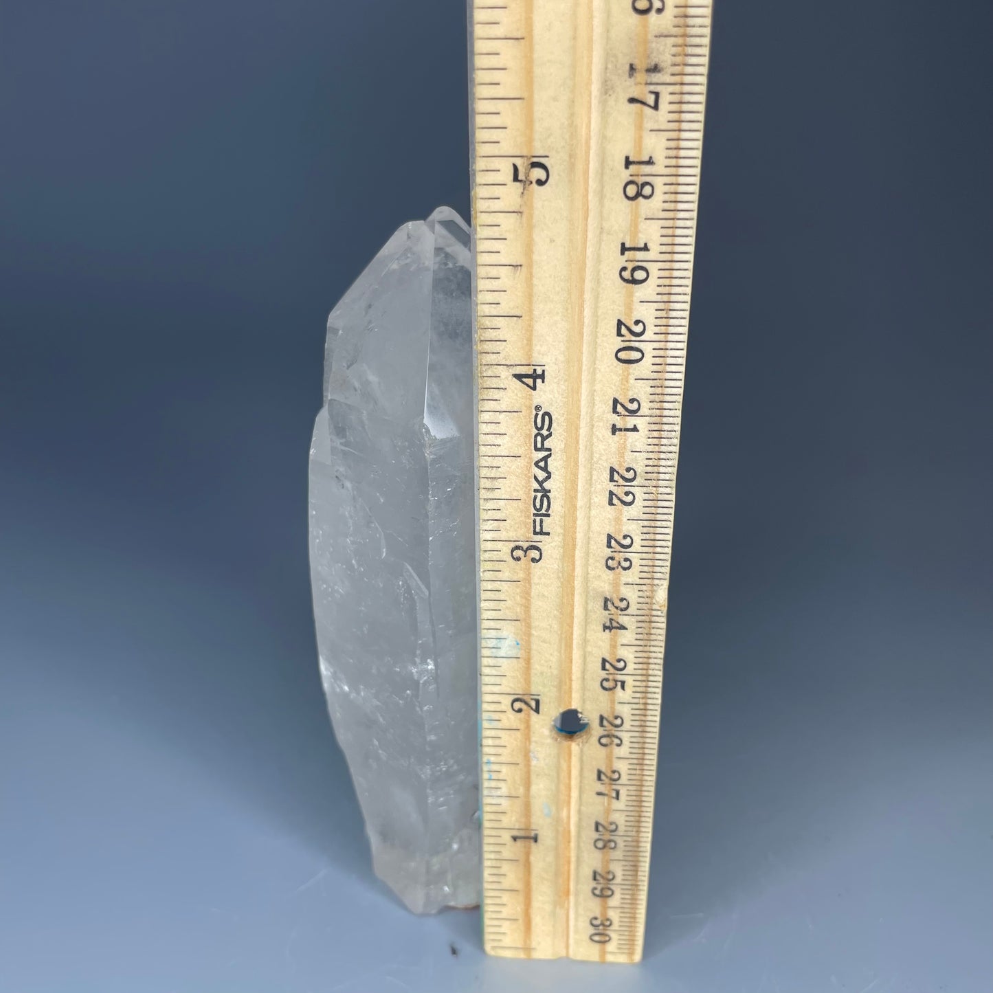 A 4.75-inch Clear Quartz double-point tower with a smooth, polished finish, standing upright against a neutral background.