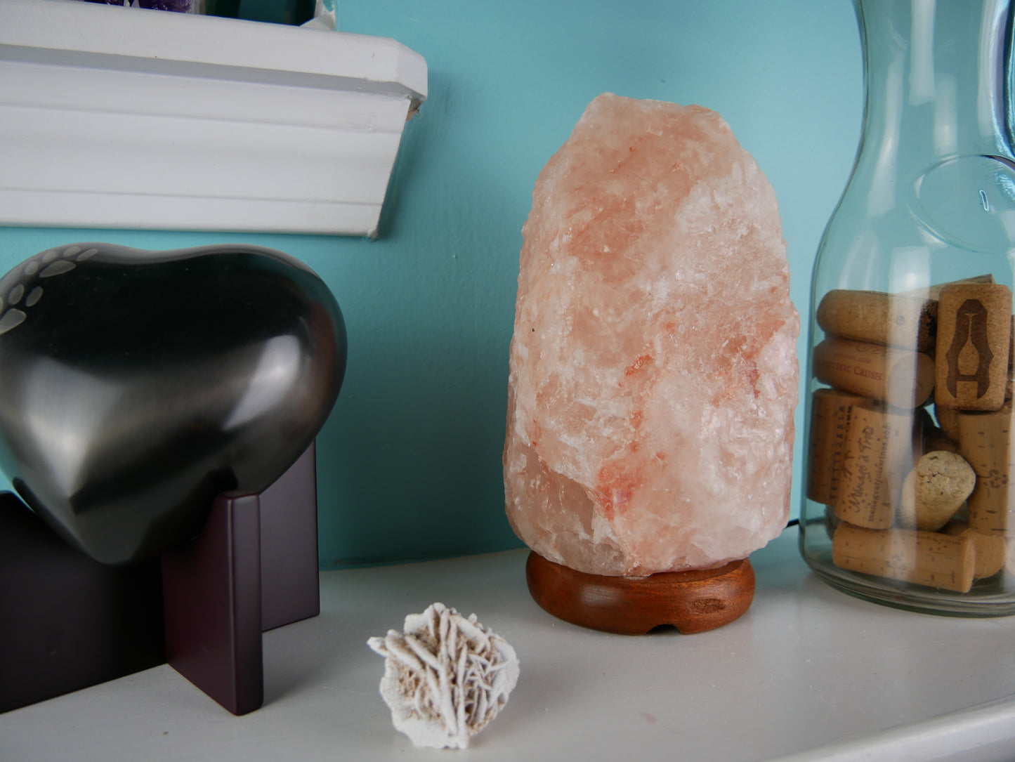 Himalayan salt lamp with wooden base
