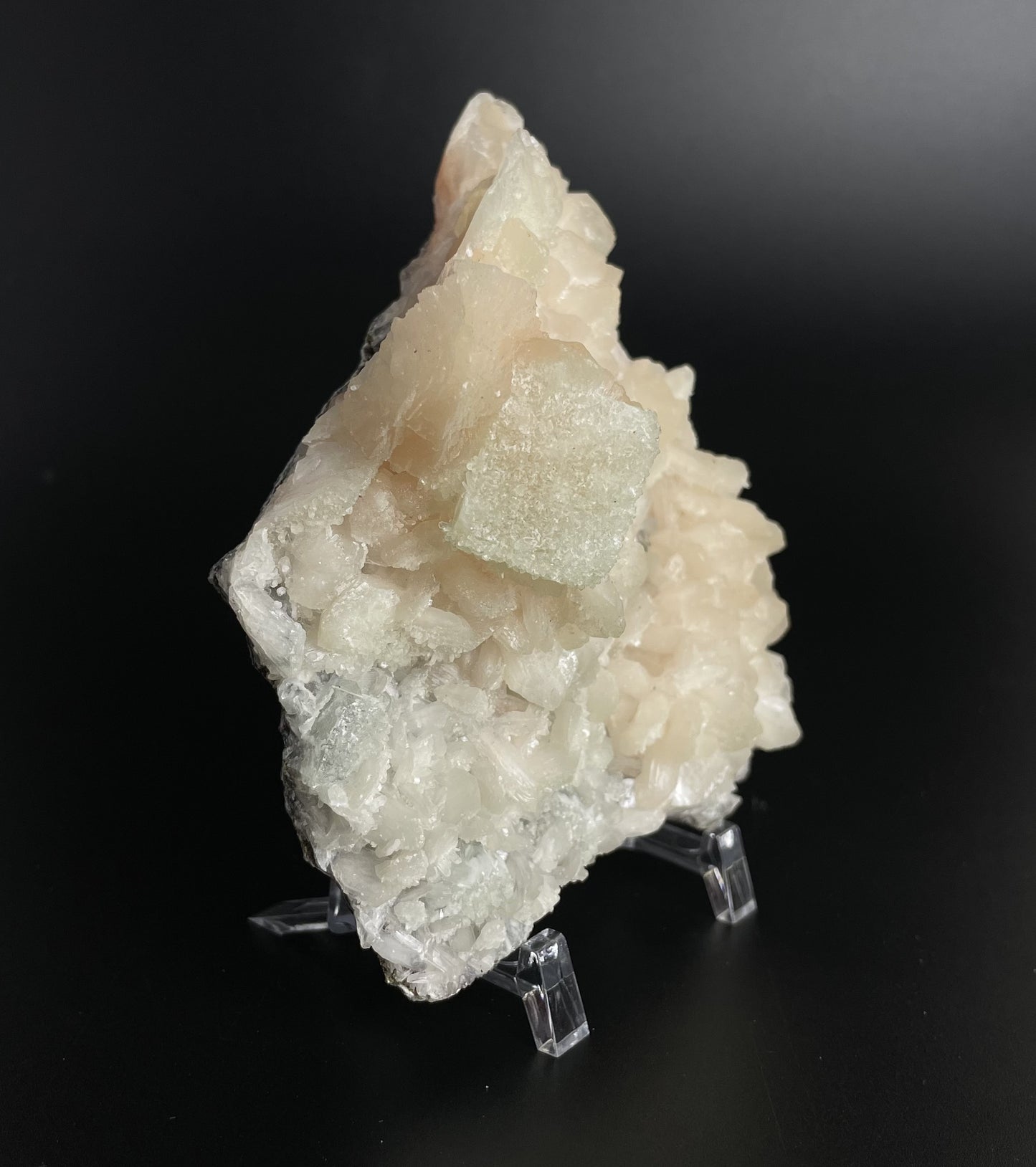 A zeolite cluster with distinctive earth-toned crystal formations.