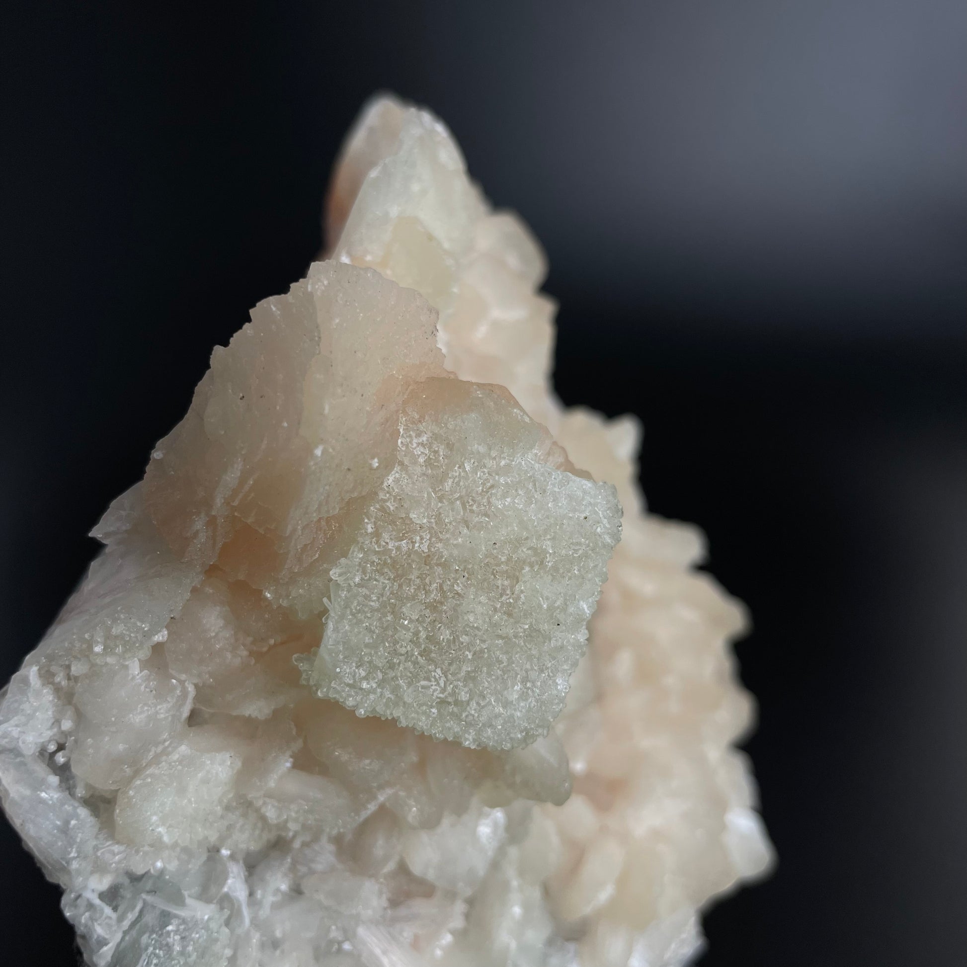 A zeolite cluster with distinctive earth-toned crystal formations.