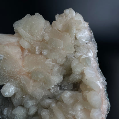 A zeolite cluster with distinctive earth-toned crystal formations.