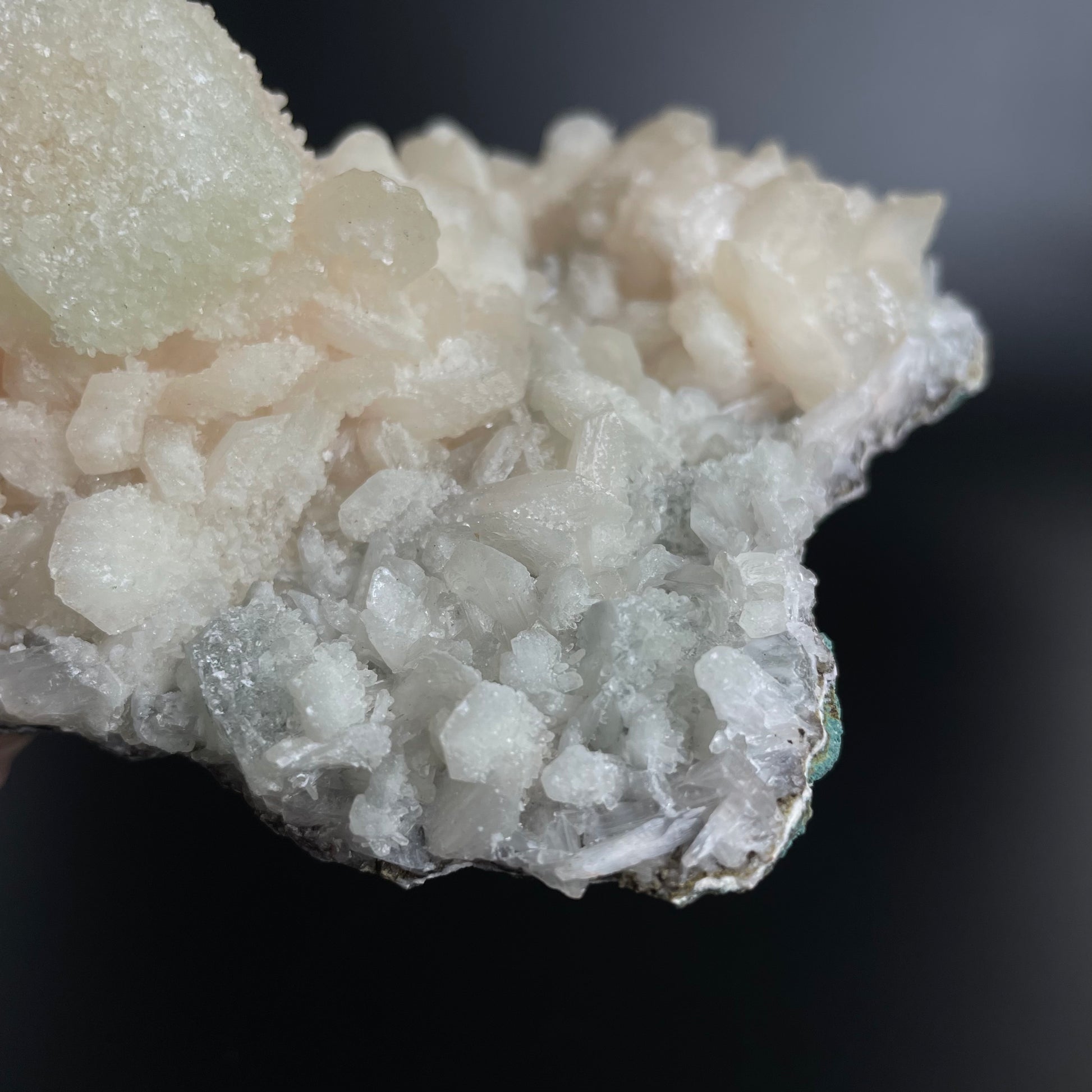 A zeolite cluster with distinctive earth-toned crystal formations.