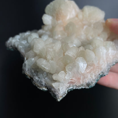 A zeolite cluster with distinctive earth-toned crystal formations.