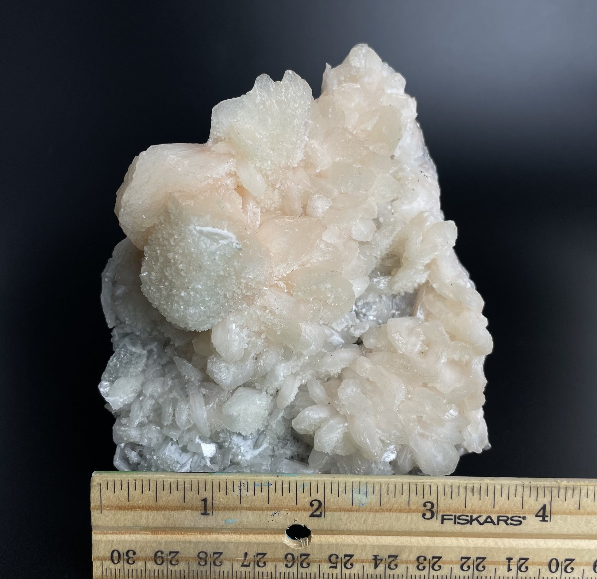 A zeolite cluster with distinctive earth-toned crystal formations.