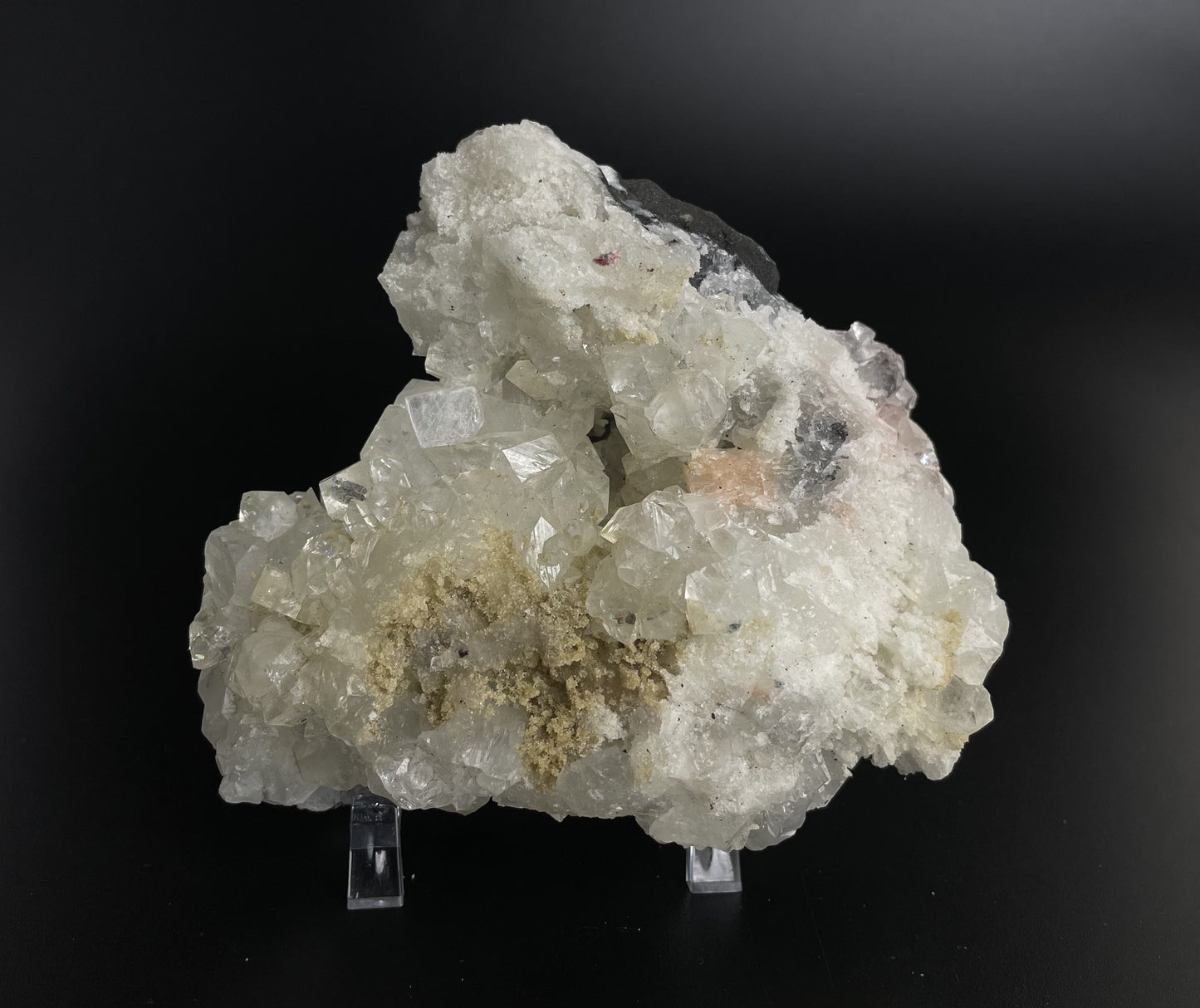 A zeolite cluster with distinctive earth-toned crystal formations.