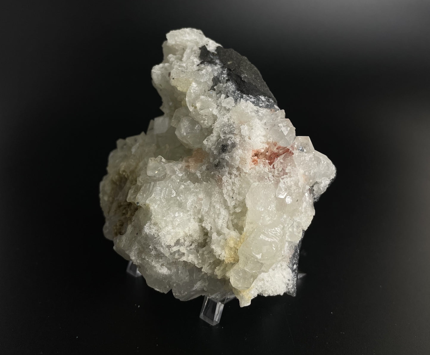 A zeolite cluster with distinctive earth-toned crystal formations.