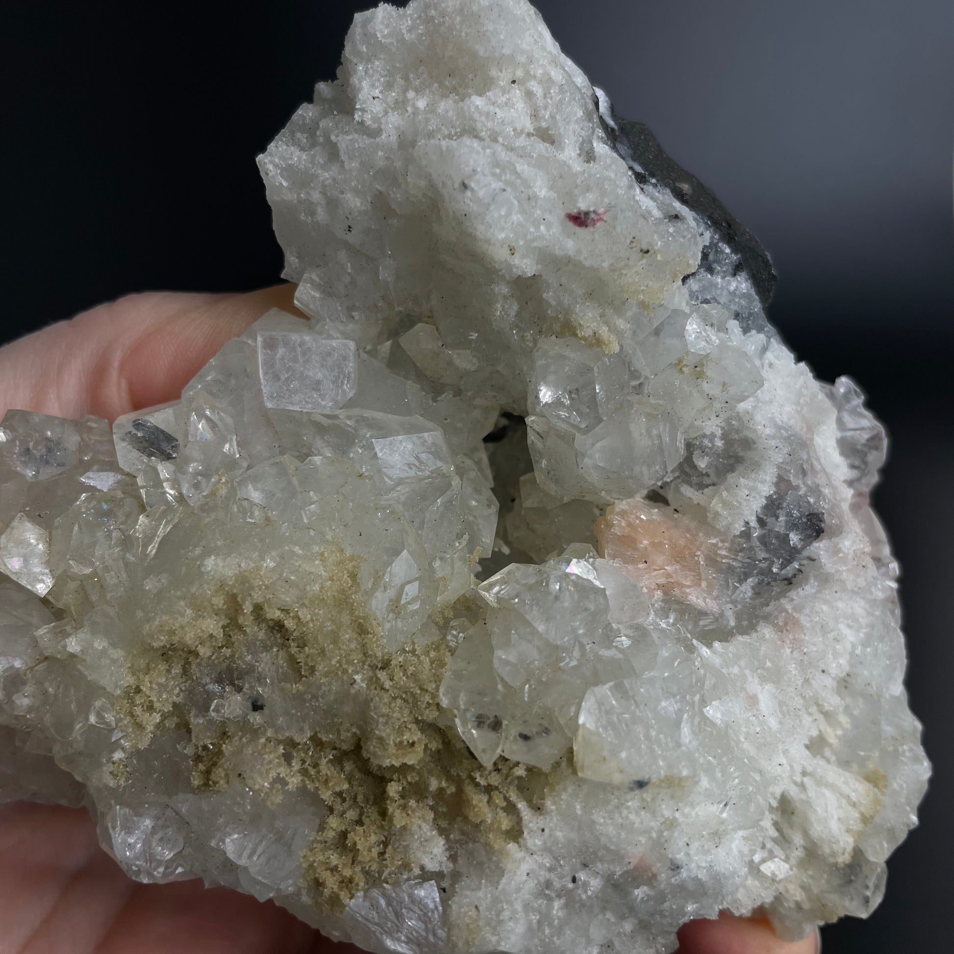 A zeolite cluster with distinctive earth-toned crystal formations.