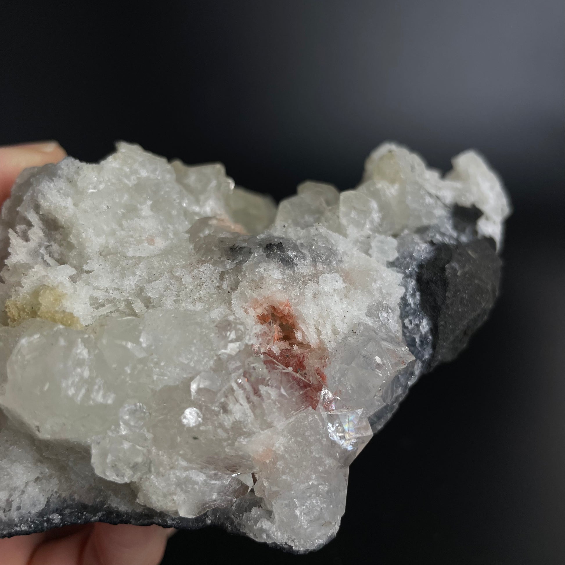 A zeolite cluster with distinctive earth-toned crystal formations.