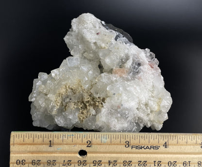 A zeolite cluster with distinctive earth-toned crystal formations.