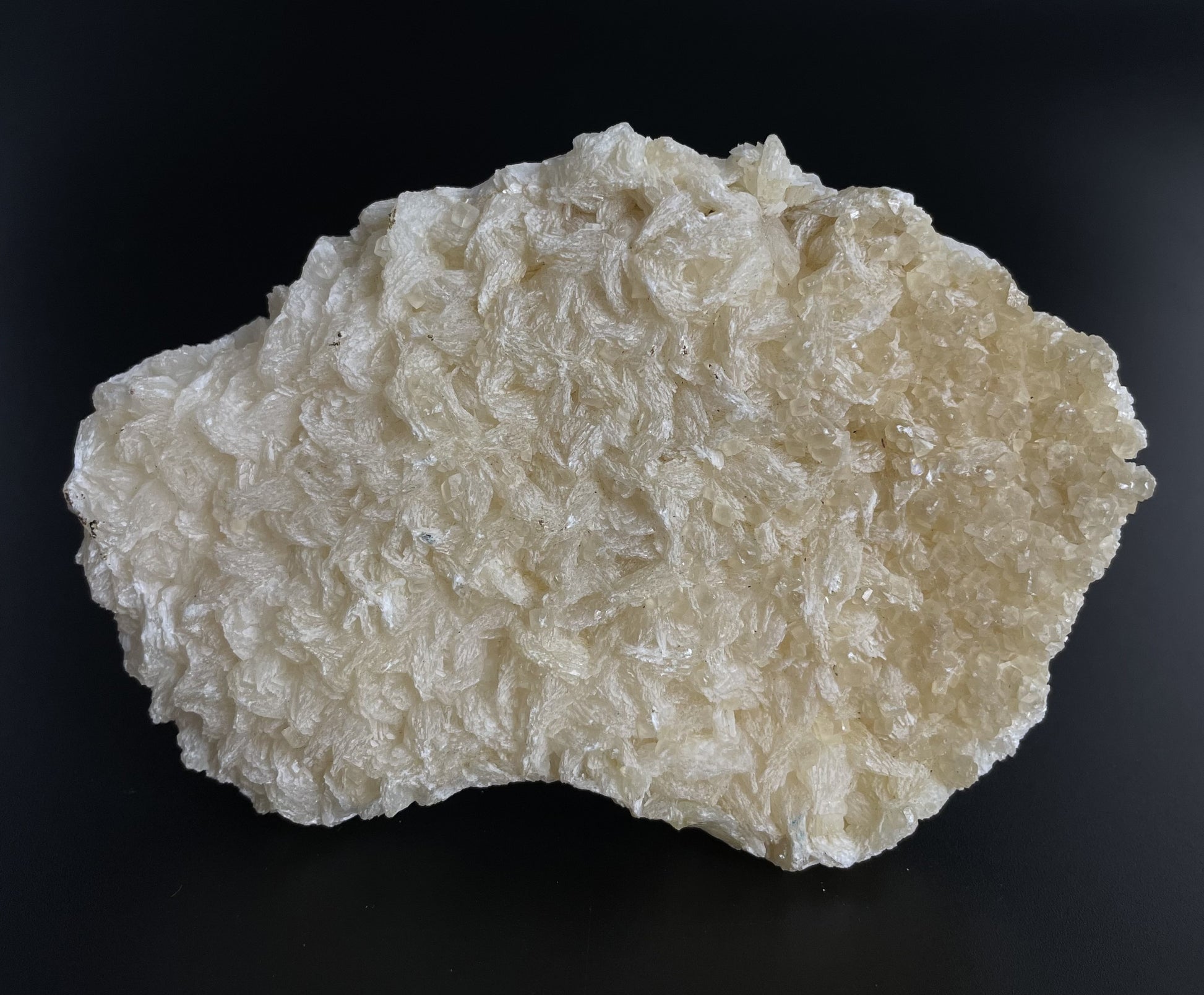 A zeolite cluster with distinctive earth-toned crystal formations.