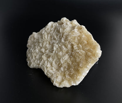 A zeolite cluster with distinctive earth-toned crystal formations.