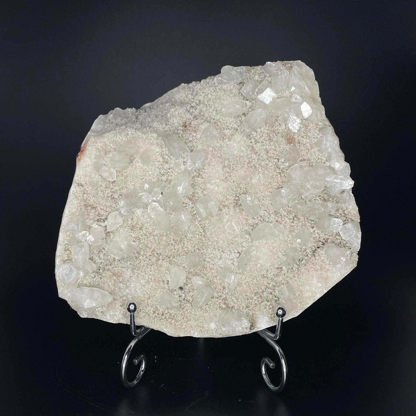 A zeolite cluster with distinctive earth-toned crystal formations.