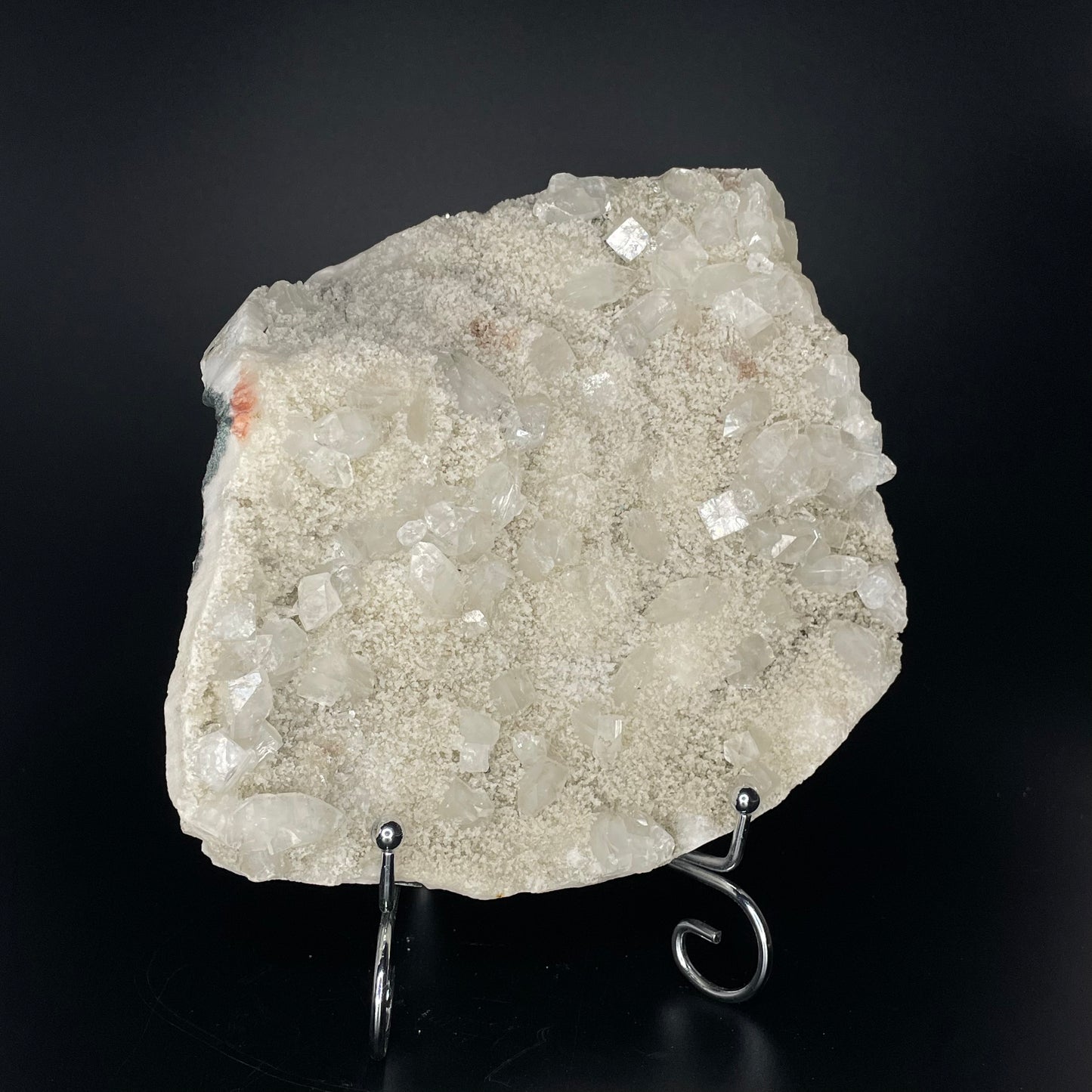 A zeolite cluster with distinctive earth-toned crystal formations.