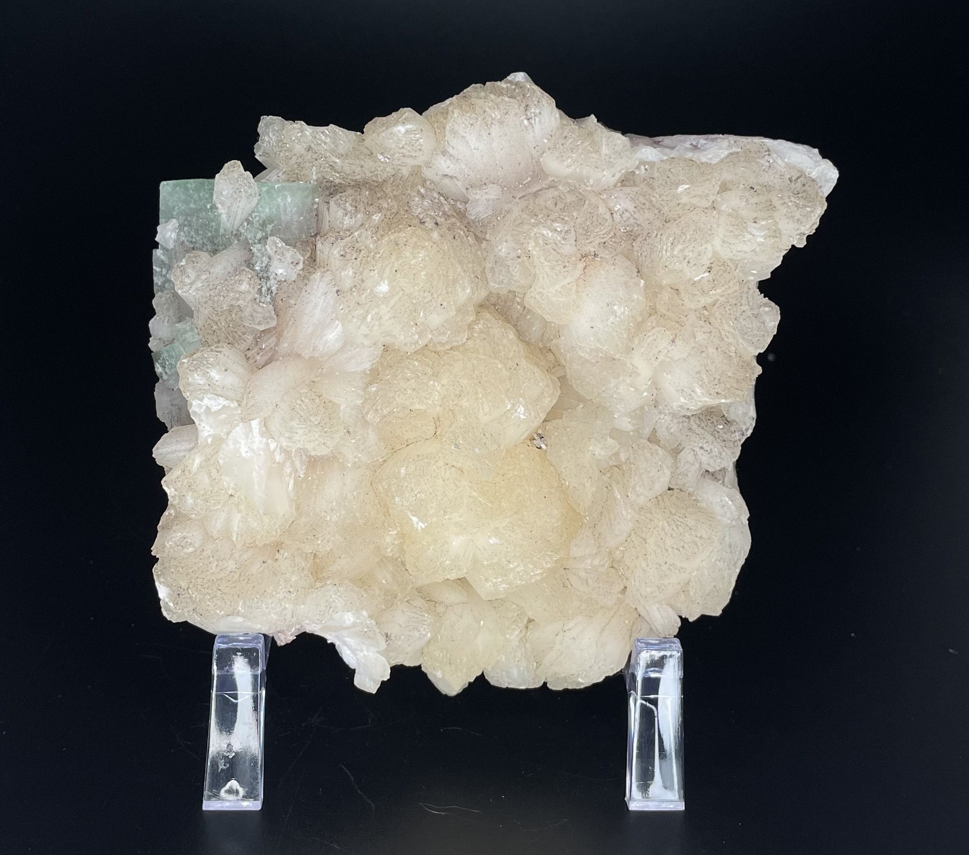 A zeolite cluster with distinctive earth-toned crystal formations.