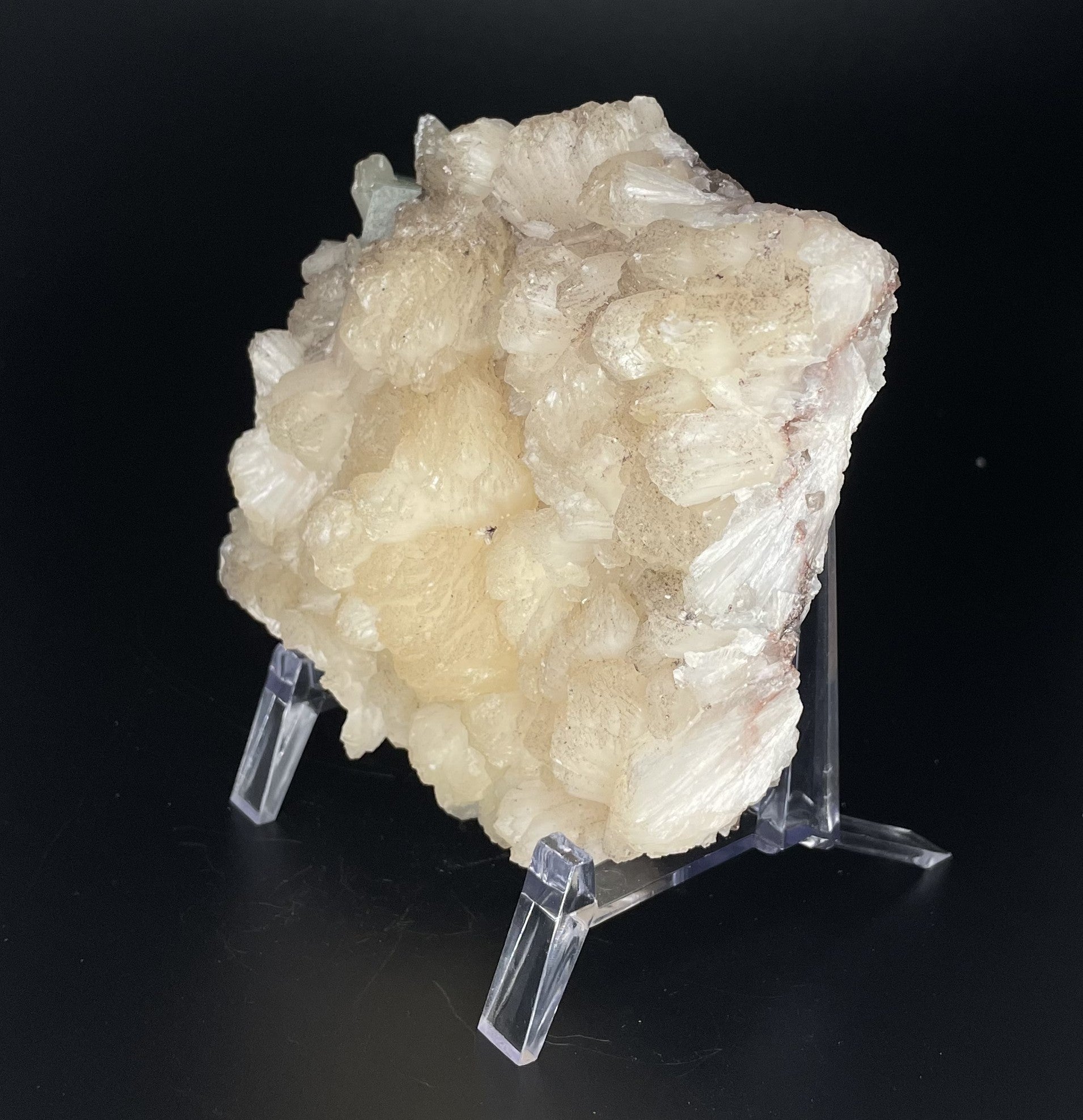 A zeolite cluster with distinctive earth-toned crystal formations.