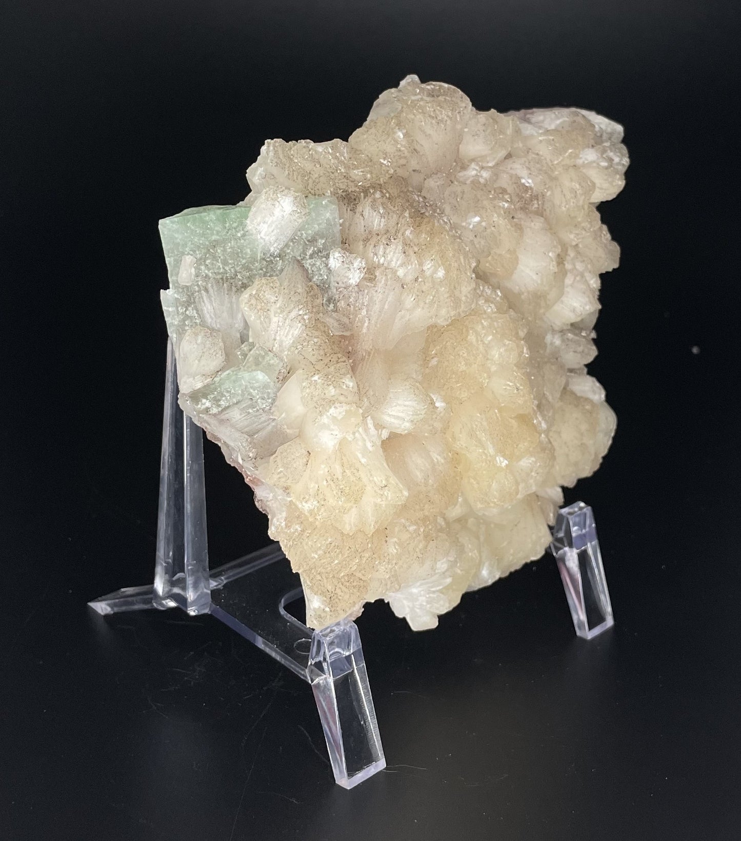 A zeolite cluster with distinctive earth-toned crystal formations.