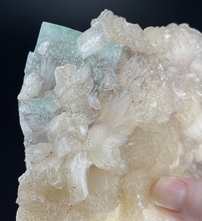 A zeolite cluster with distinctive earth-toned crystal formations.