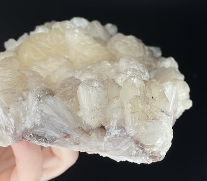 A zeolite cluster with distinctive earth-toned crystal formations.