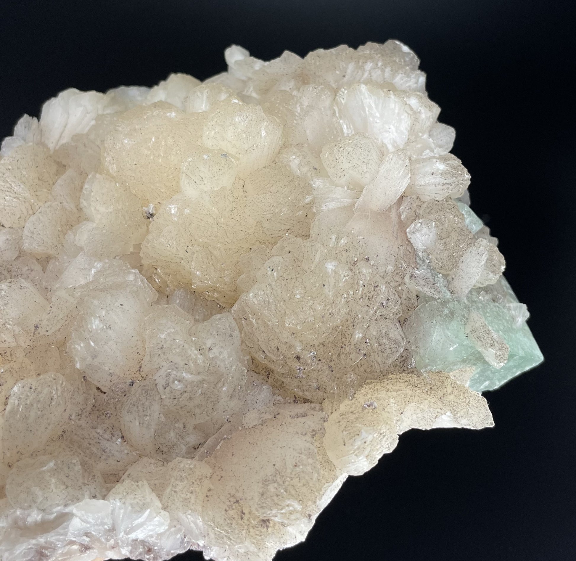 A zeolite cluster with distinctive earth-toned crystal formations.