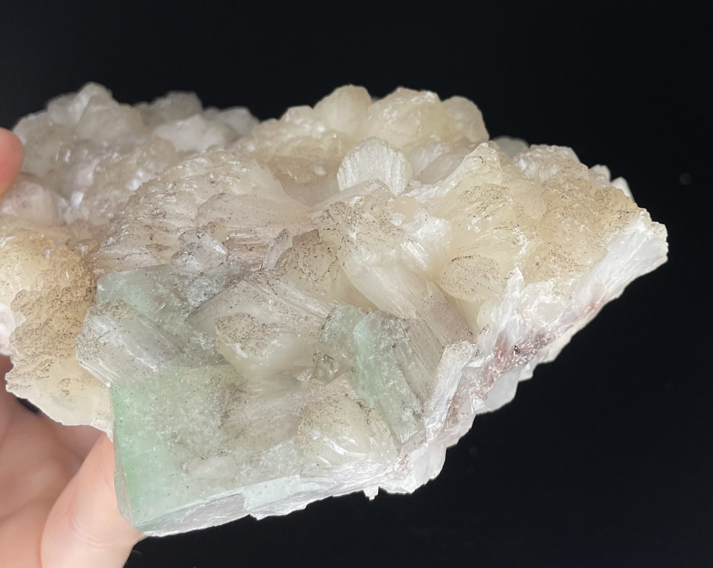 A zeolite cluster with distinctive earth-toned crystal formations.