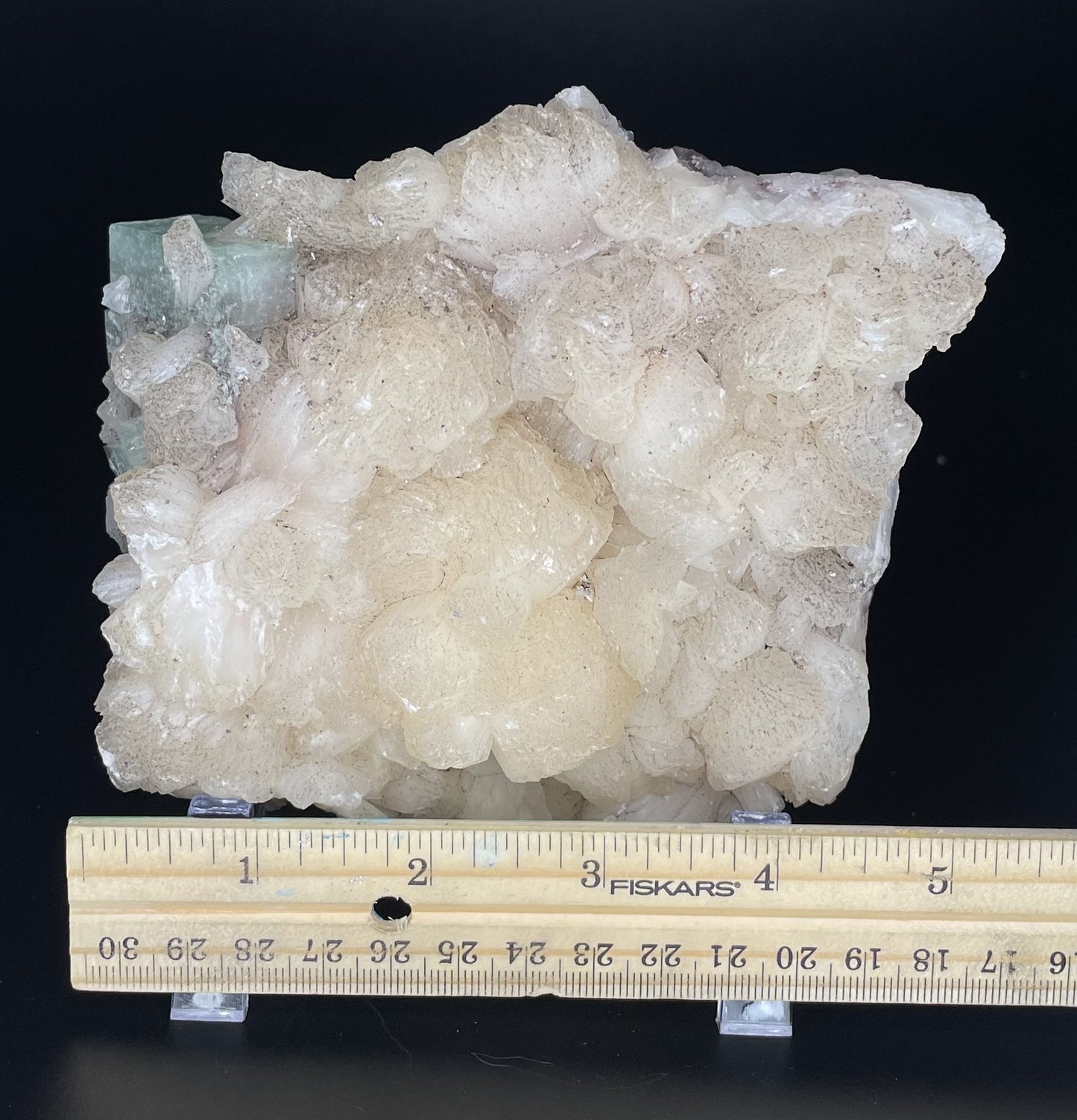 A zeolite cluster with distinctive earth-toned crystal formations.