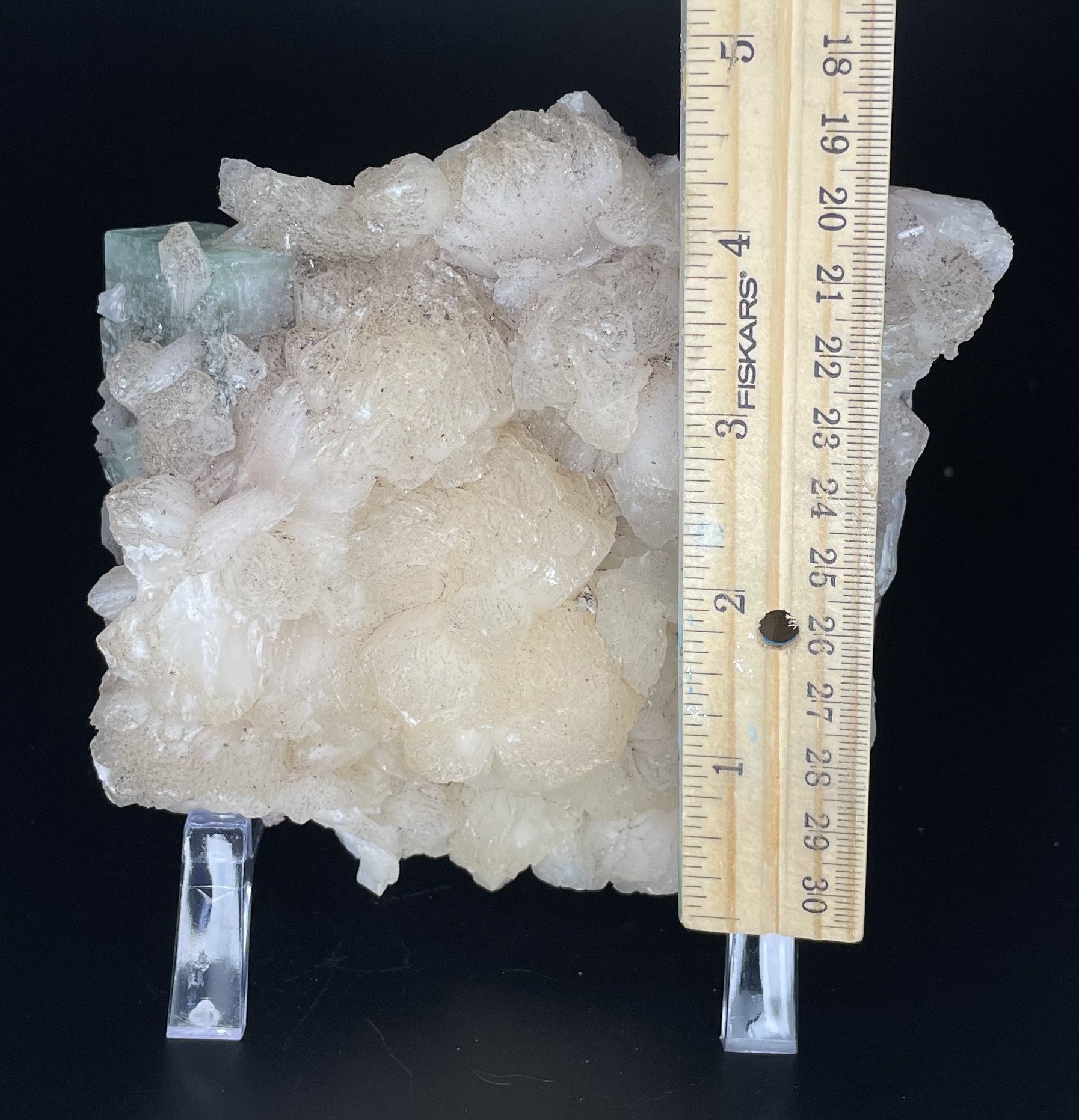 A zeolite cluster with distinctive earth-toned crystal formations.