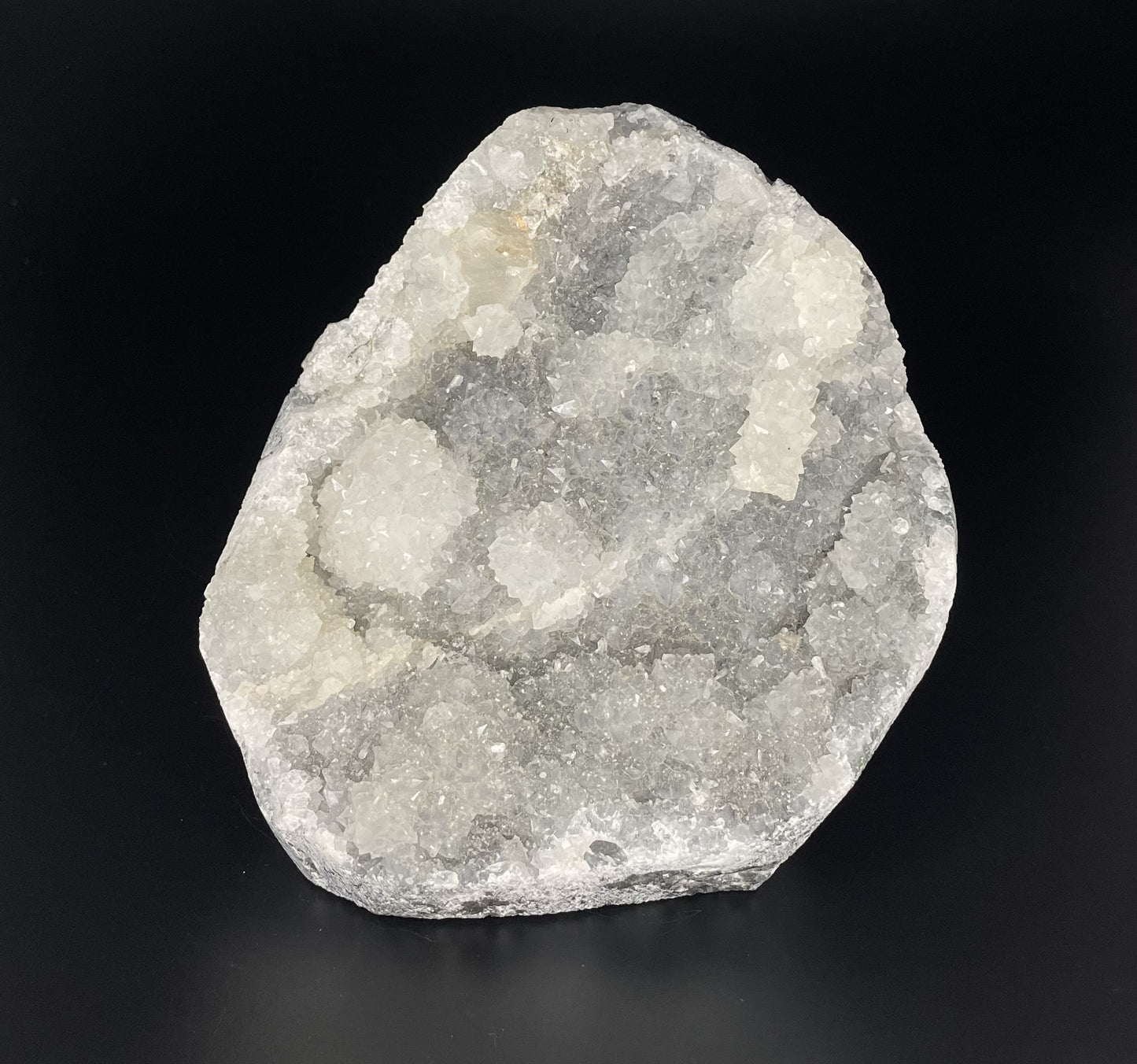 A zeolite cluster with distinctive earth-toned crystal formations.