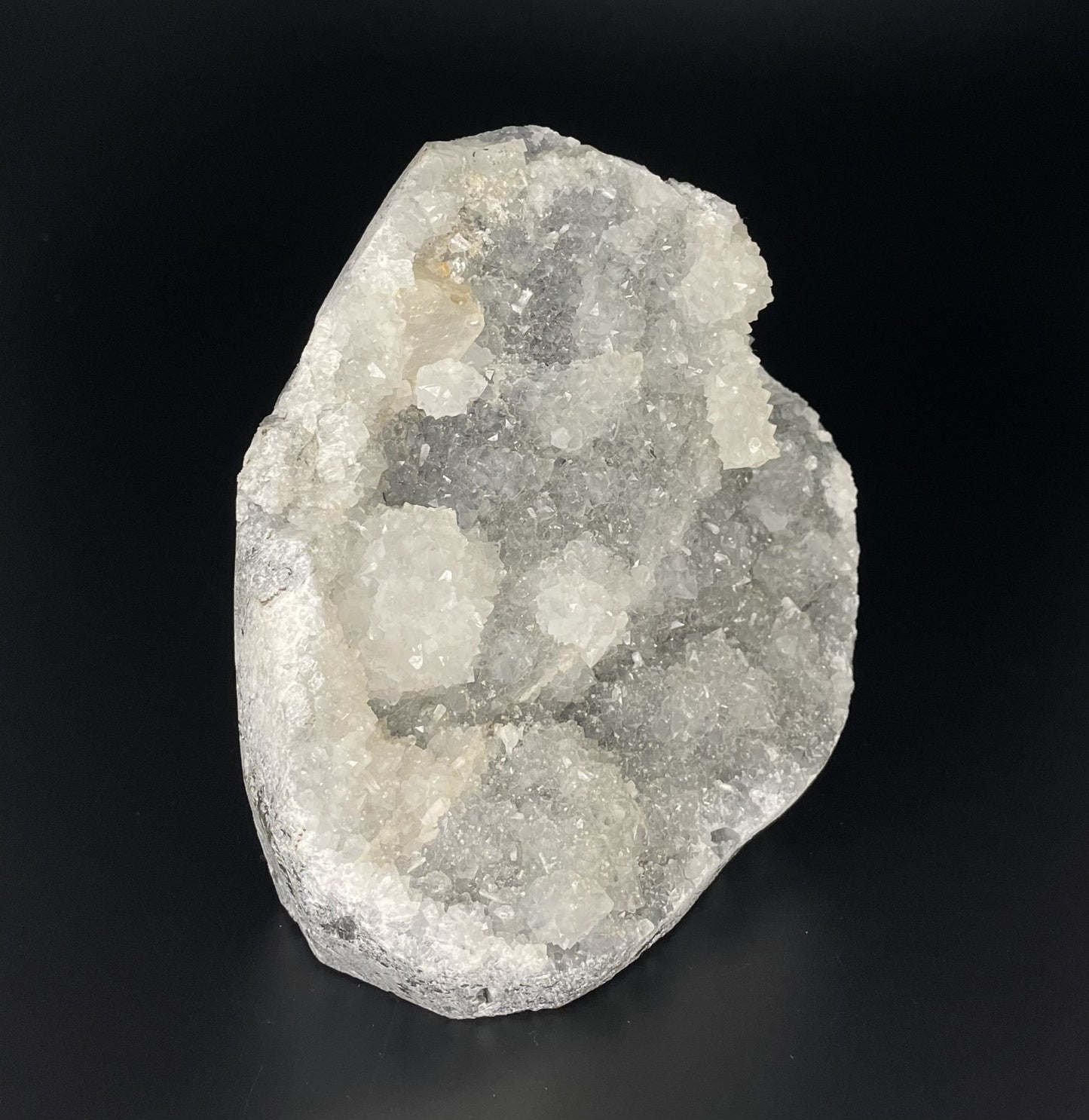 A zeolite cluster with distinctive earth-toned crystal formations.