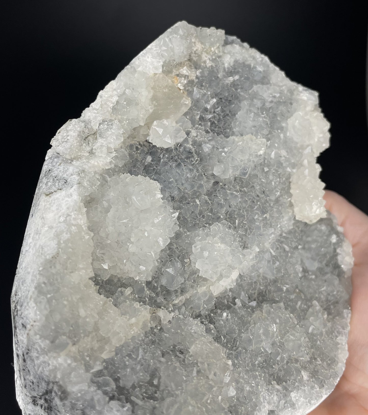 A zeolite cluster with distinctive earth-toned crystal formations.