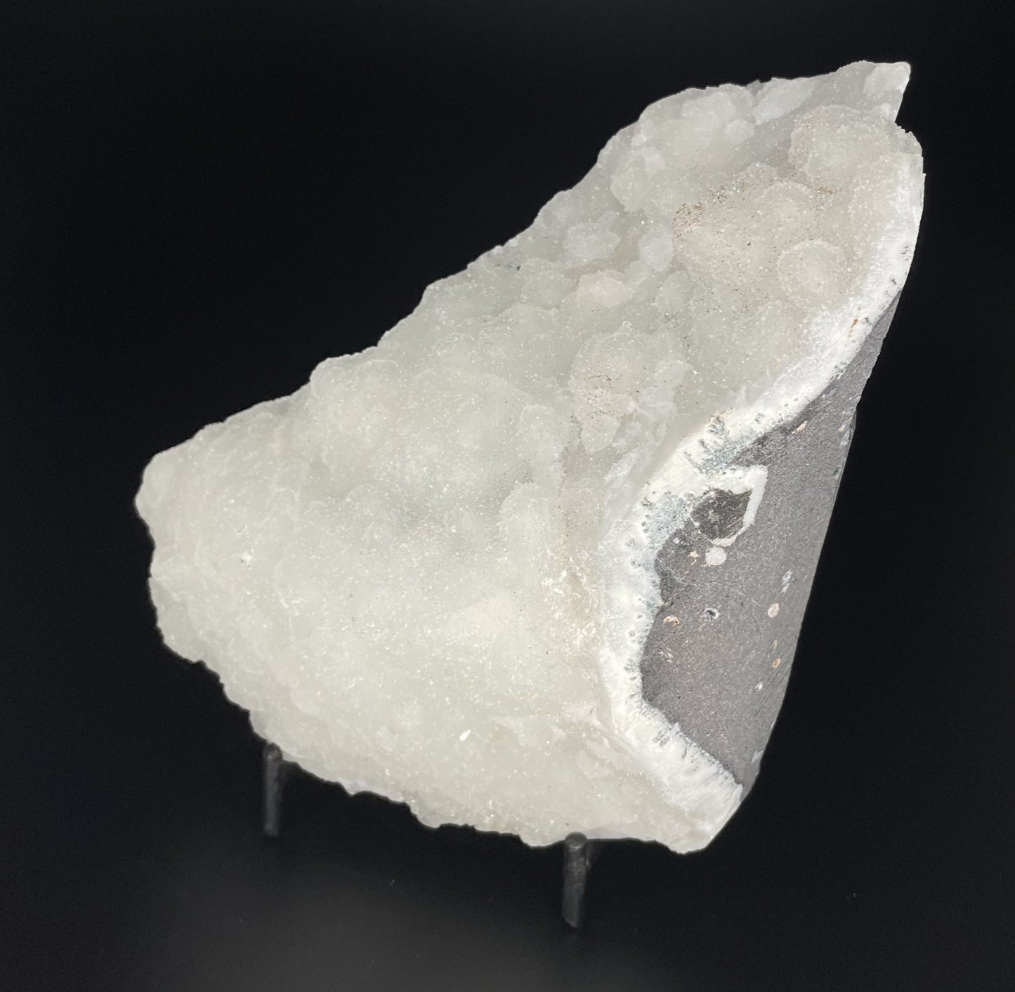 A zeolite cluster with distinctive earth-toned crystal formations.