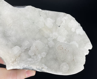 A zeolite cluster with distinctive earth-toned crystal formations.