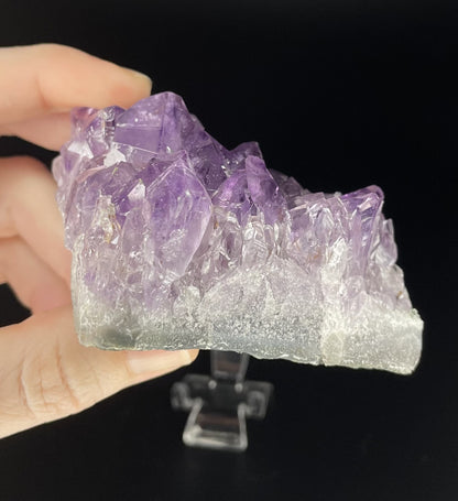 Amethyst cluster with brilliant hues of purple and various sizes of crystal formations