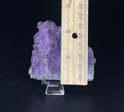 Amethyst cluster with brilliant hues of purple and various sizes of crystal formations