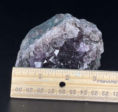 Amethyst cluster with brilliant hues of purple and various sizes of crystal formations