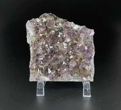 Amethyst cluster with brilliant hues of purple and various sizes of crystal formations