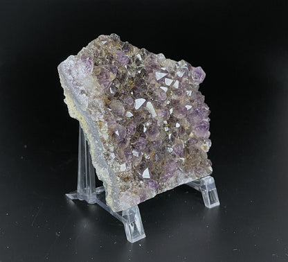 Amethyst cluster with brilliant hues of purple and various sizes of crystal formations