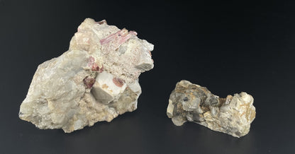 A close-up image of two mineral specimens featuring creamy Orthoclase crystals intergrown with clear quartz and dark tourmaline, showcasing a striking blend of textures and colors.