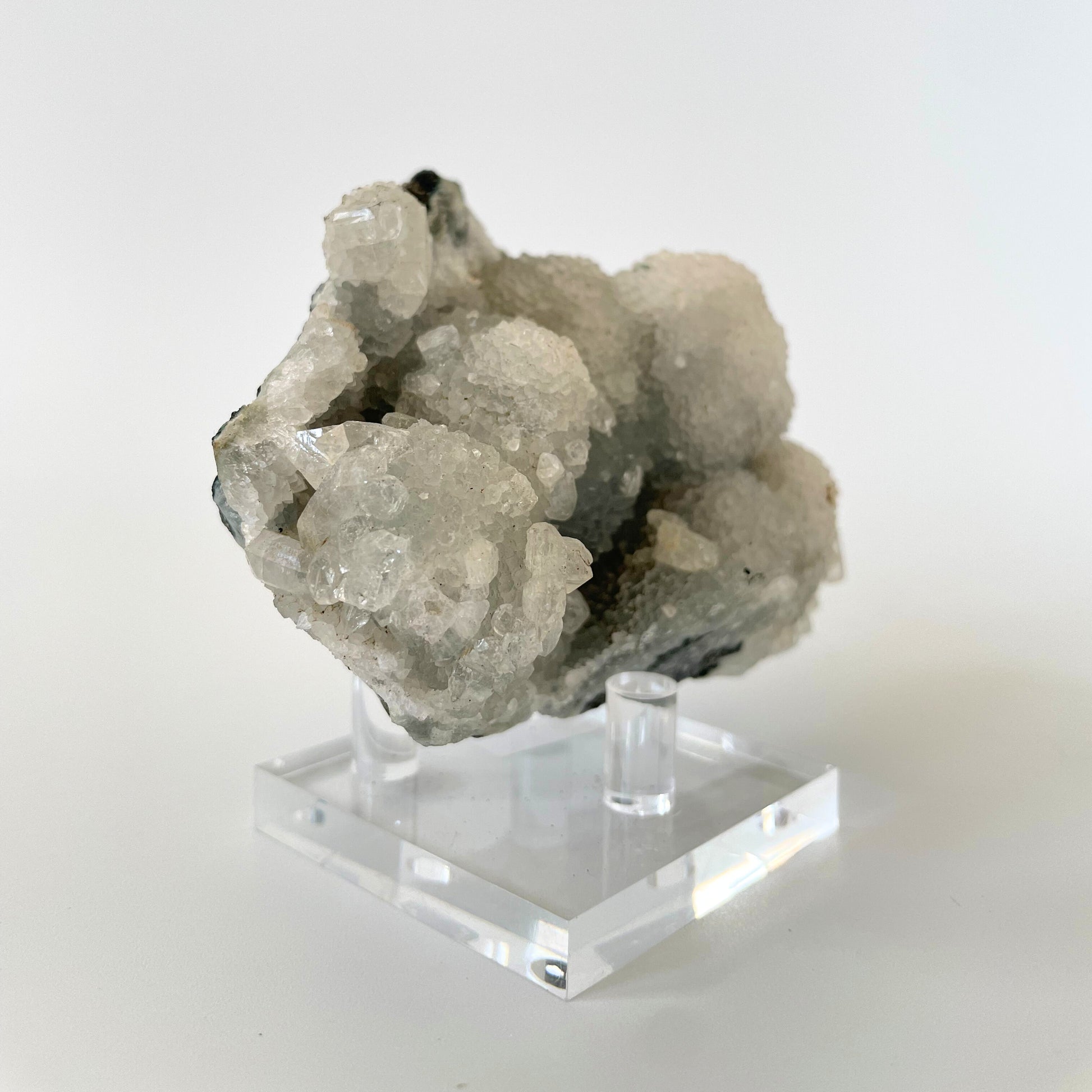 A 4-inch rare blue chalcedony cluster with soft blue hues on a white background.