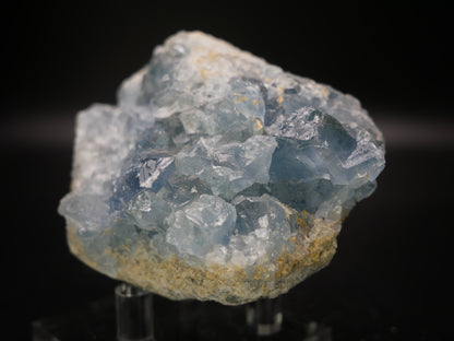 A stunning Celestite cluster weighing 369.6 grams, featuring delicate sky-blue crystals radiating from a central point. The cluster is a natural wonder, showcasing the beauty of Celestite's crystalline structure and soothing color palette.