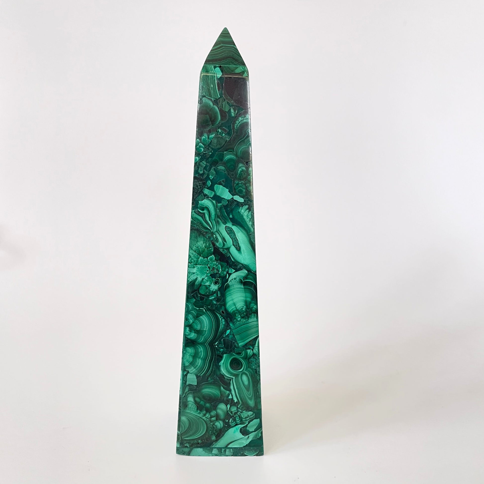 A 5.92-inch malachite obelisk with vibrant green hues and intricate patterns on a white background.