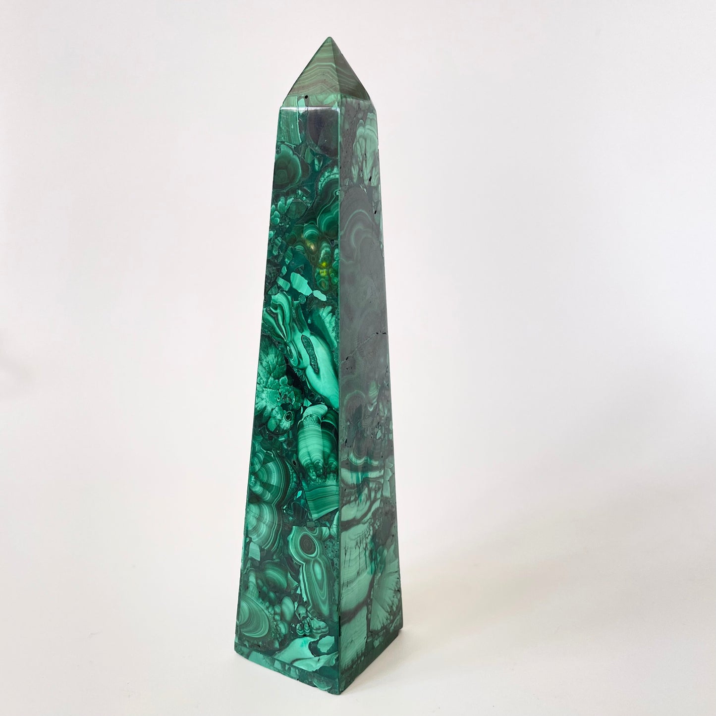 A 5.92-inch malachite obelisk with vibrant green hues and intricate patterns on a white background.