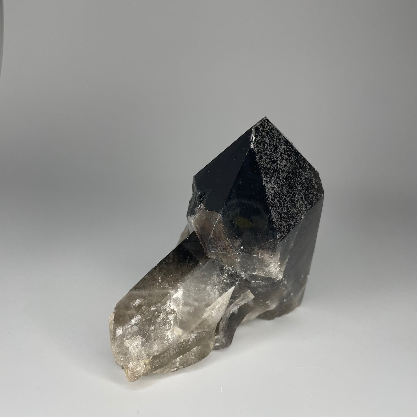 A large 24-ounce Smoky Quartz Cluster with deep, smoky hues and natural crystal formations.