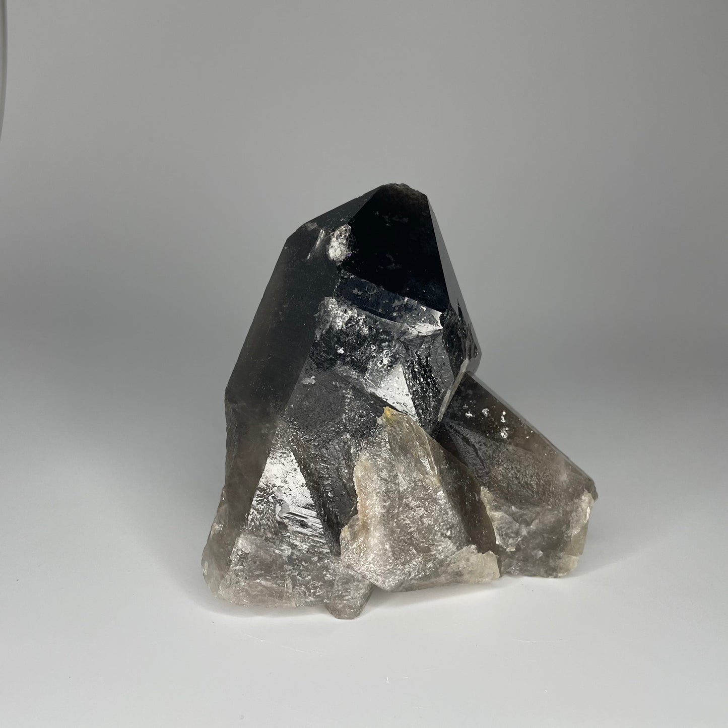 A large 24-ounce Smoky Quartz Cluster with deep, smoky hues and natural crystal formations.