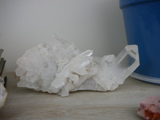 A 6.15-inch clear quartz cluster with distinctive crystal formations on a neutral background.